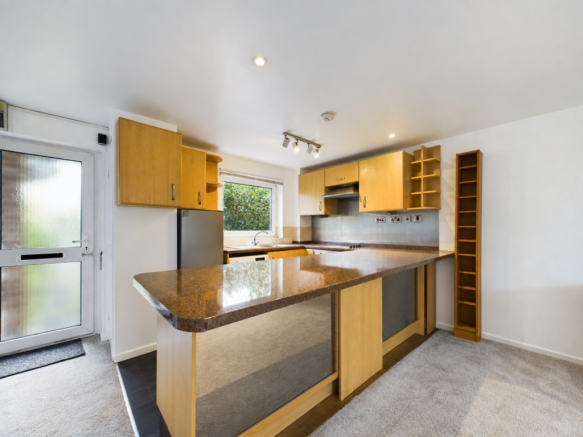 Tidied kitchen with breakfast bar