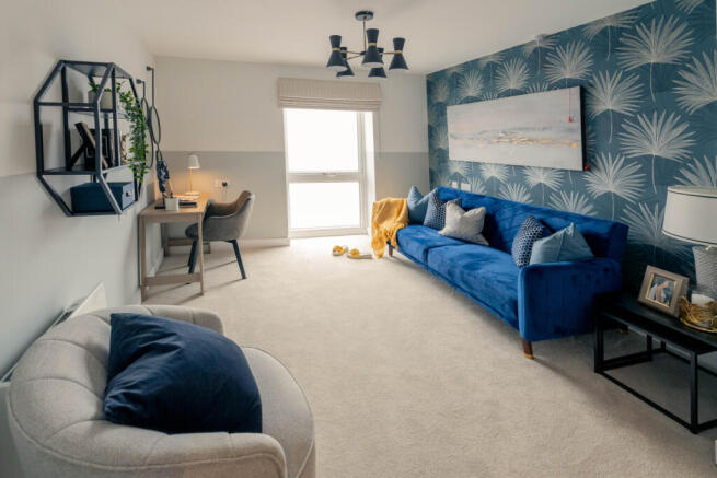 a living room with a blue couch