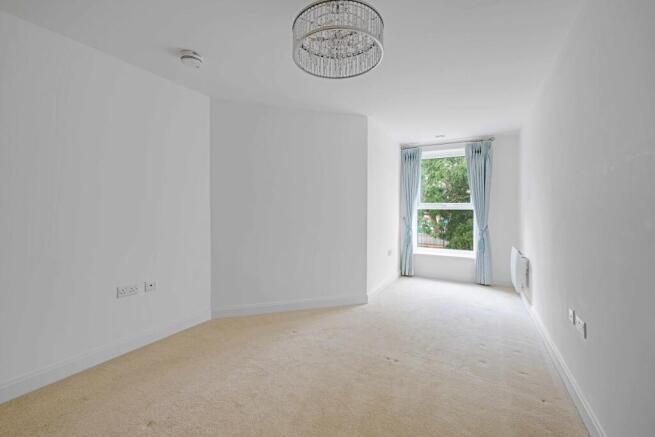 a room with a window and a fan