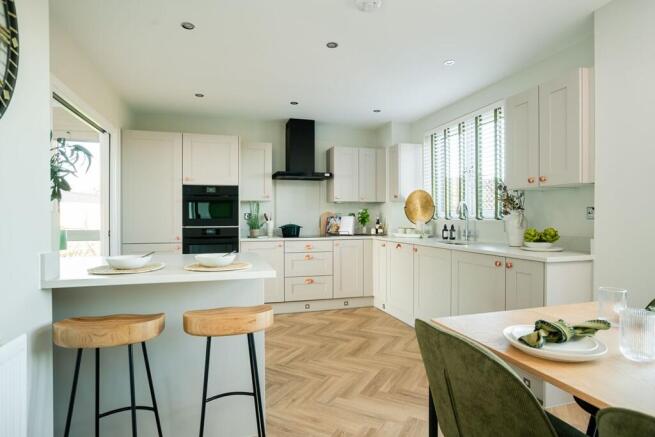 A modern kitchen area with an island counter