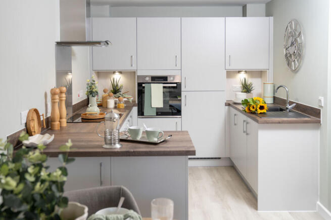 a kitchen with white cabinets