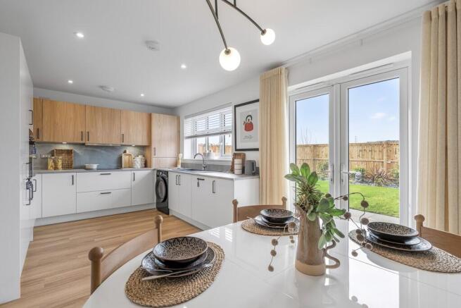 3 bedroom showhome | open plan kitchen and dining area with french doors to rear garden