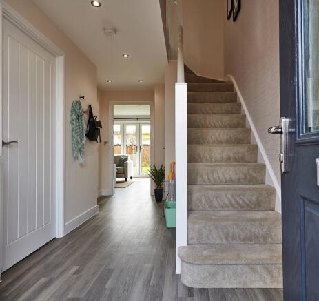 Welcoming entrance hall with under stair storage