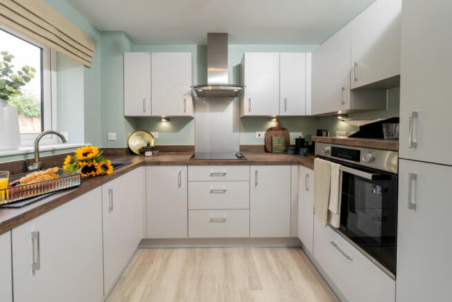 a kitchen with white cabinets