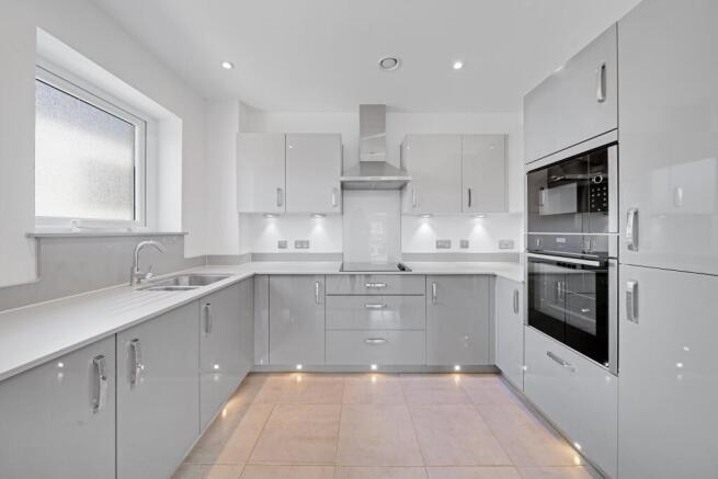 a kitchen with white cabinets