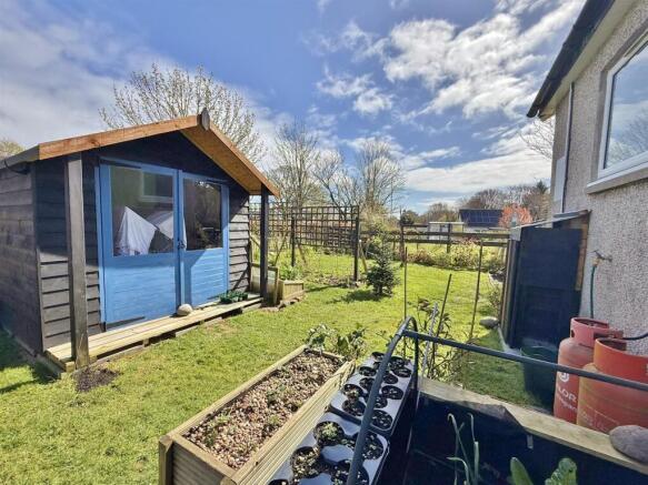 Rear garden and view to Holy isle