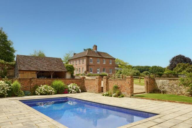 Swimming pool framed by the house
