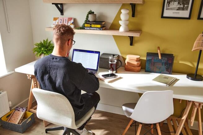 There's ample room in the bedroom to dedicate space for a home office