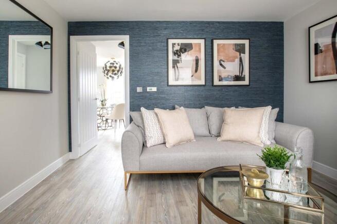 The cosy living room leads through to the dining area