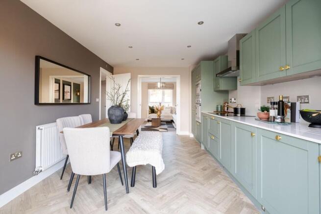A modern kitchen and dining area with ample storage