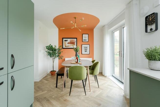 French doors in the dining area fill the room with natural light