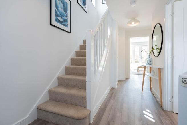 Bright hallway with under stairs storage