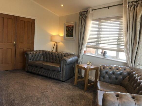 Comfortable Lounge With Leather Seating And Large