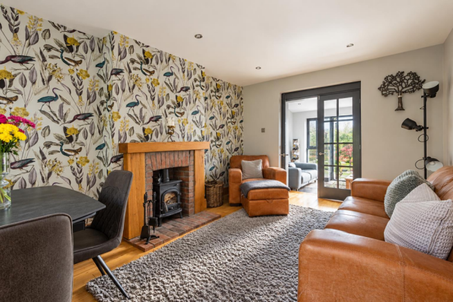 Sunlit Botanical Living Room with Fireplace.png
