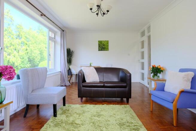 Sitting room with parquet flooring