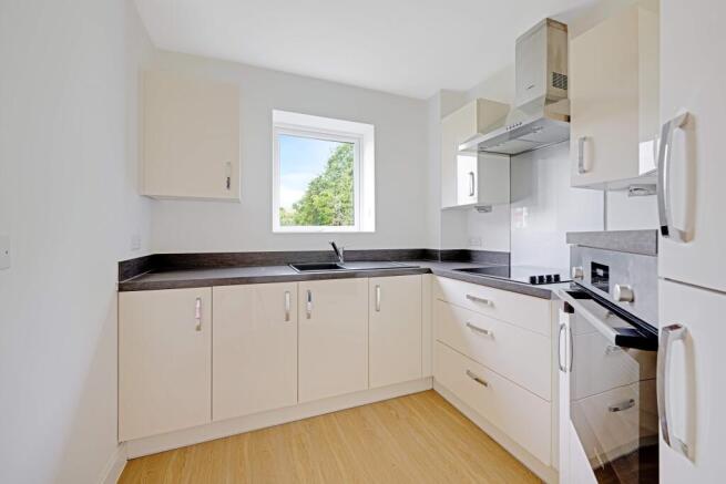 a kitchen with white cabinets
