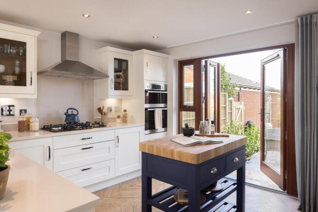 Internal shot of the kitchen with double doors in the conwy show home