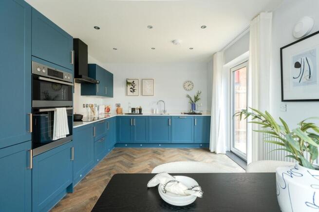 The open plan kitchen diner has doors out to the rear garden