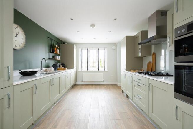 The kitchen is spacious with plenty of storage