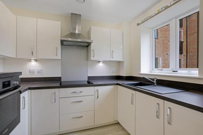 a kitchen with white cabinets