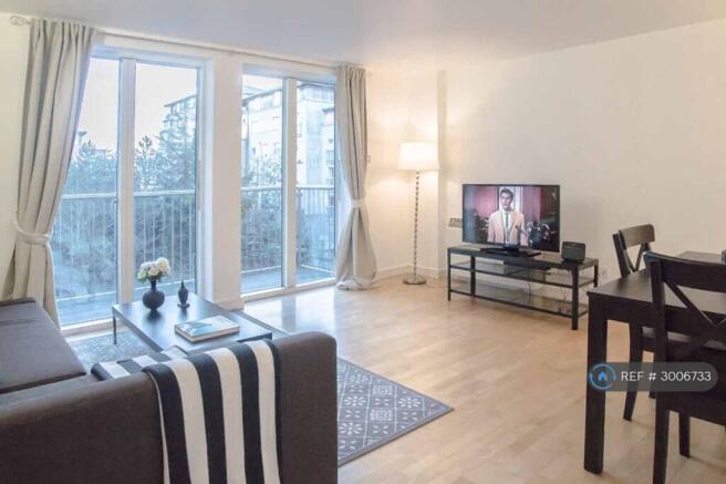 Spacious Living Room With Plenty Of Sunlight