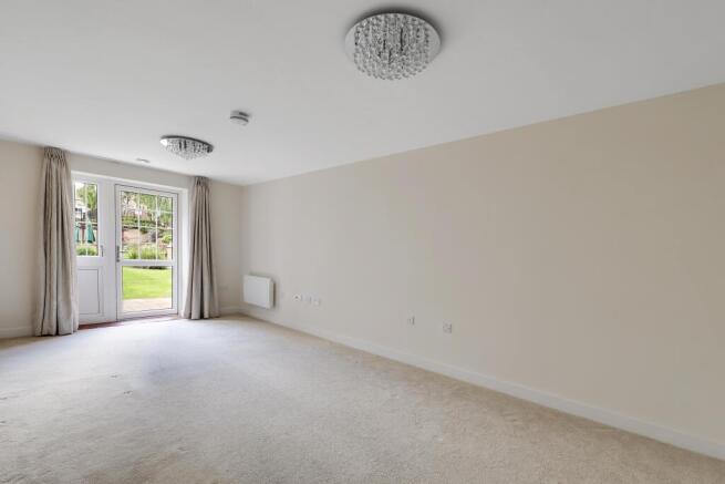 a room with a carpet and a window