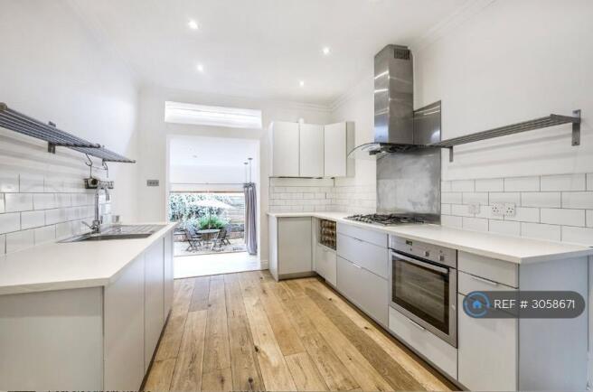 Open Plan Kitchen And Living Space Out To Garden