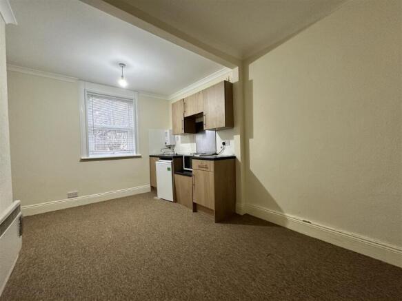 Bright kitchen area with contemporary cabinets...