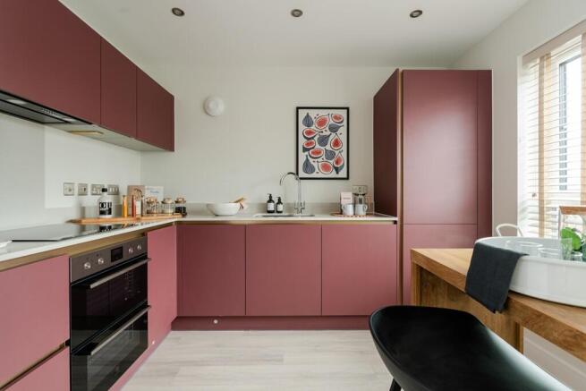 A modern kitchen to the front of the home