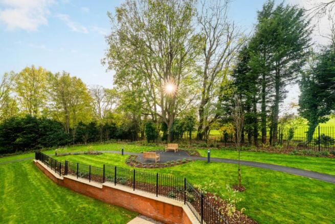 a park with a fence and trees