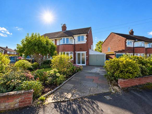 Sunlit Red-Brick Suburban Home.png