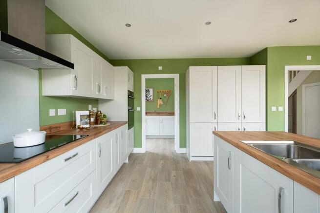 There's a useful utility room off the kitchen, with access to the driveway