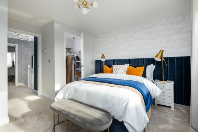The main bedroom is complete with a walk-in wardrobe and ensuite
