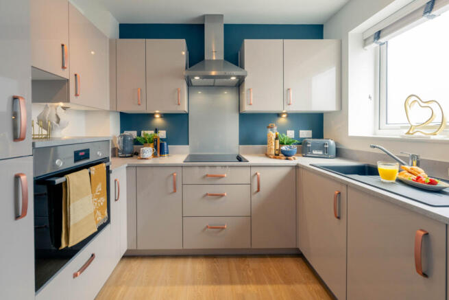 a kitchen with white cabinets