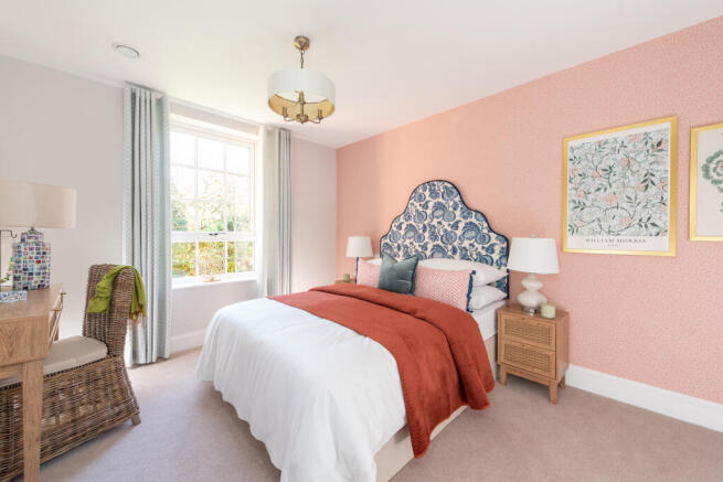 a bedroom with a bed and lamps