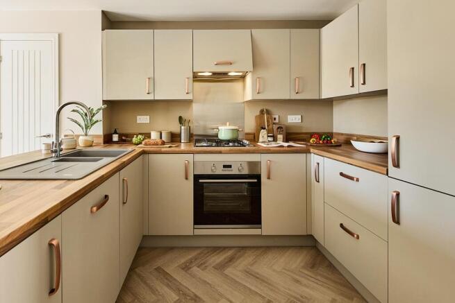 Kitchen is modern with ample storage