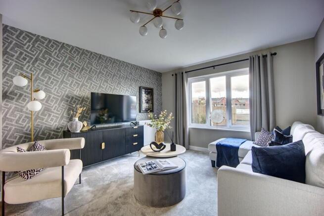 A spacious lounge with sliding doors leading to the kitchen