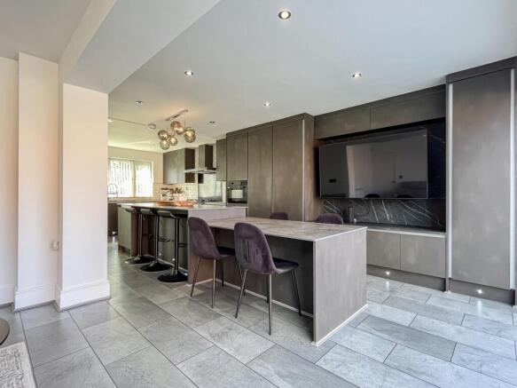 OPEN PLAN STYLE KITCHEN AND SITTING AREA