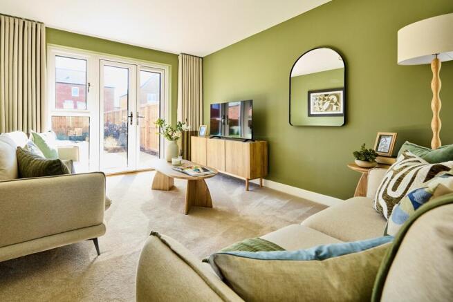 The living room is spacious with space for the whole family to chill out together