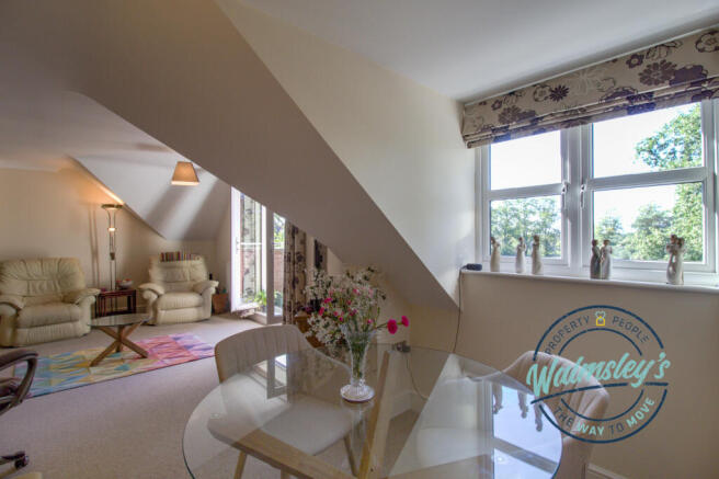 Dining area with sitting area beyond