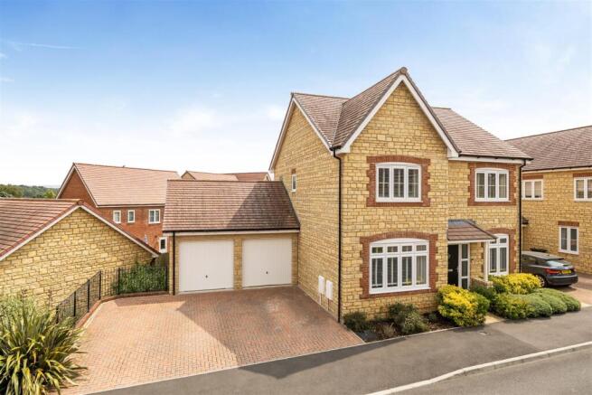 Front Elevation with double garages and driveway