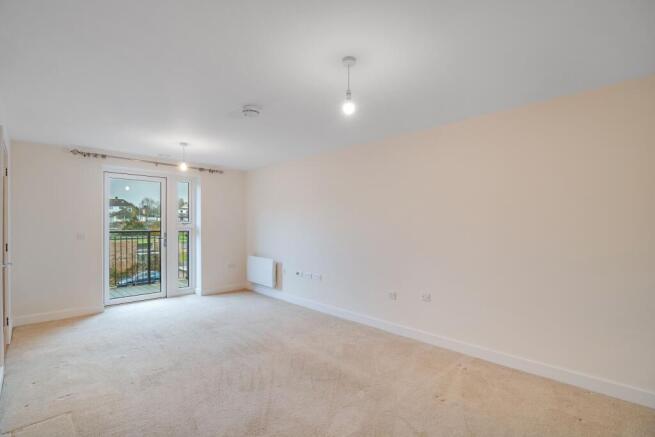 a room with a carpet and a door