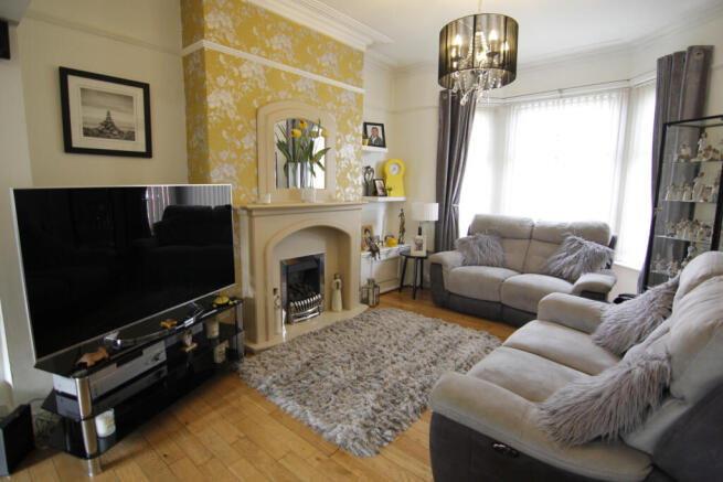 FOUR BEDROOMED BAY FRONTED MID TERRACE