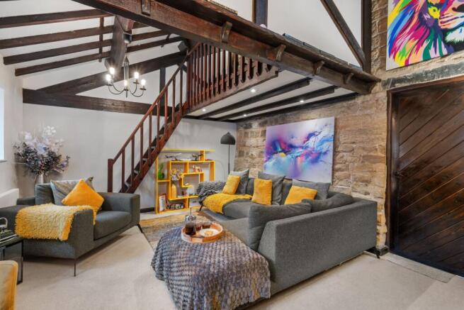 Living room with stairs to mezzanine