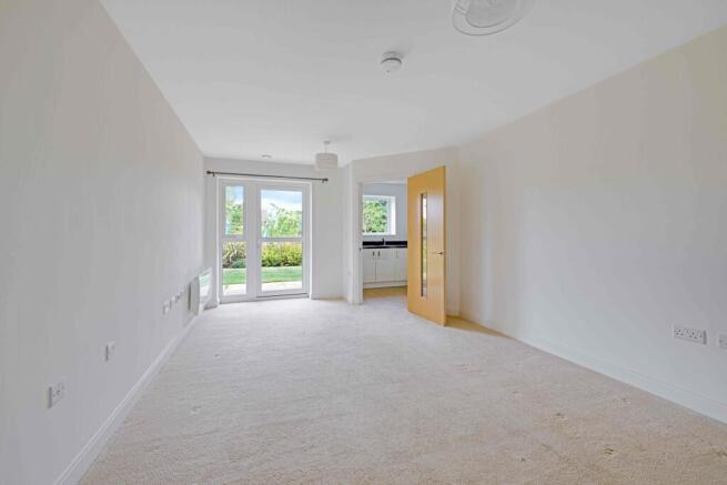 a room with a carpet and a door