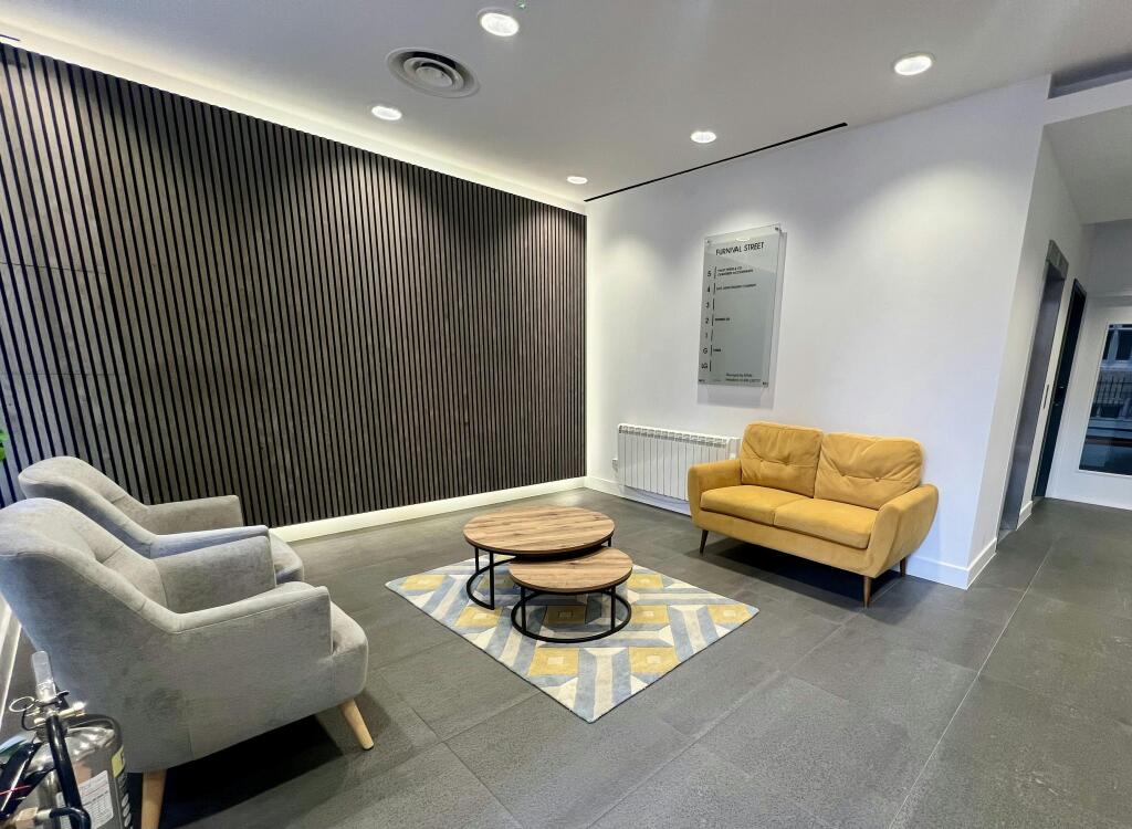 3031 Furnival  Modern Lobby With Seating And Decorative Wall Paneling.jpg
