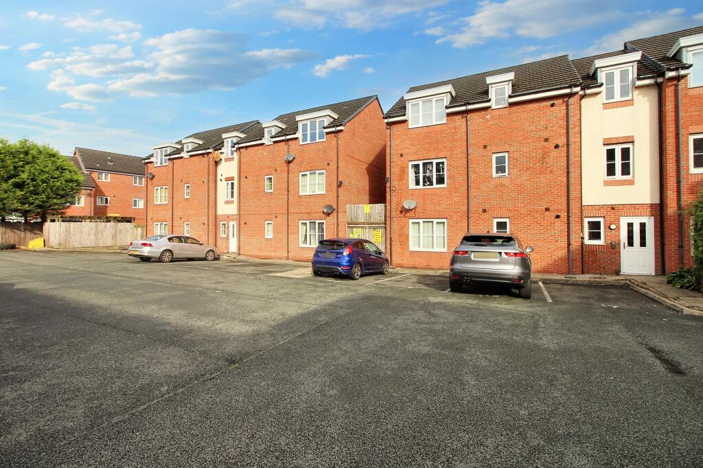 Main image of property: Modern top floor apartment with parking, perfect for first-time buyers or investors. No chain.