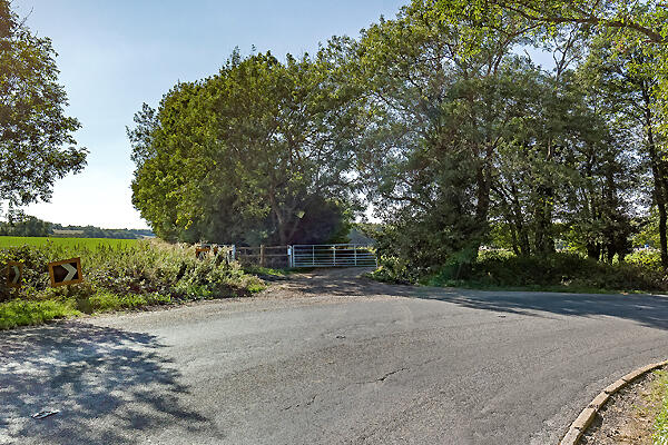 Access is via a gated entrance to the south.