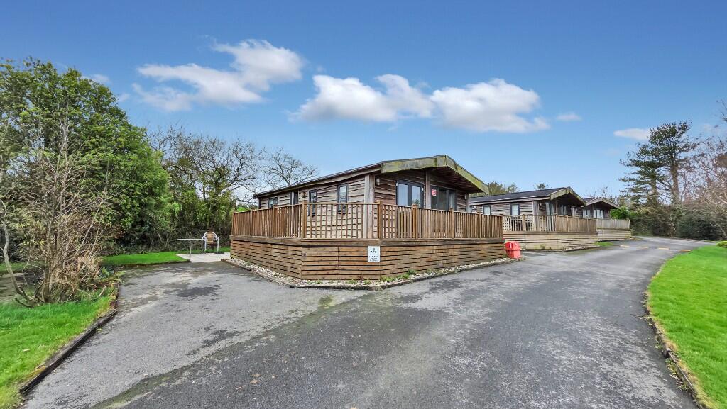 Main image of property: Walknut Lodge, Hentevene Holiday Park, EX23 0LF