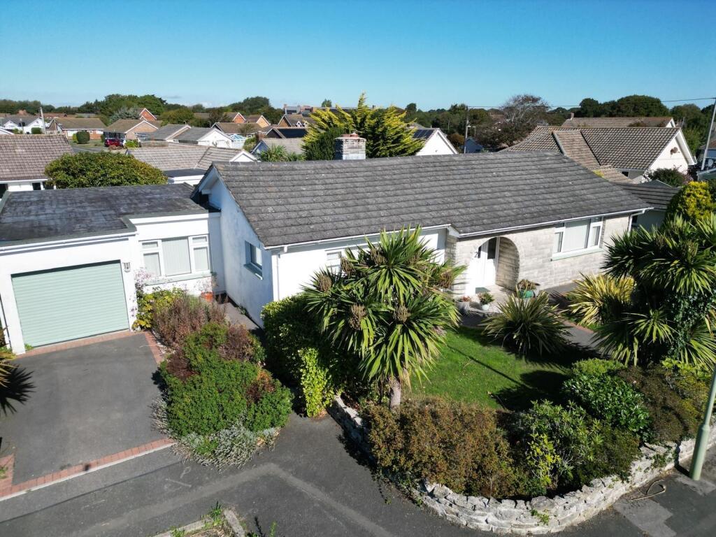 Main image of property: Woodlawn Close, Barton On Sea, New Milton, Hampshire. BH25 7BY